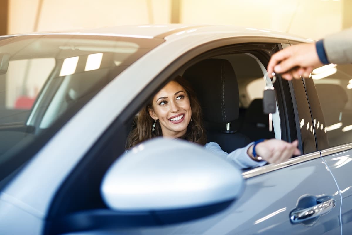 Woman going on a test drive in a new car